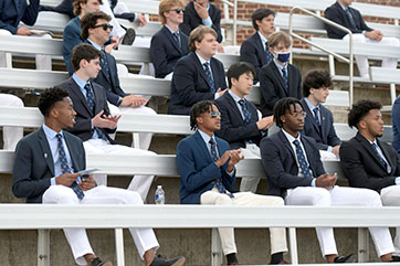 Students sitting on bleachers. Links to Gifts of Appreciated Securities